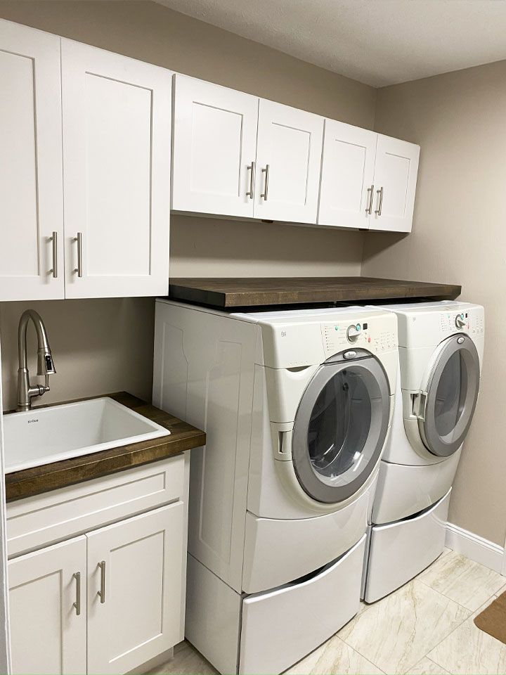 anm-contracting-projects-laundry-room-with-white-cabinets-and-walnut-wooden-cabinets-vert
