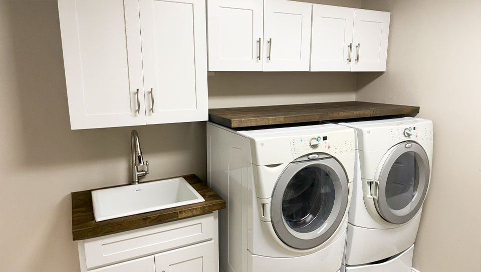 anm-contracting-projects-laundry-room-with-white-cabinets-and-walnut-wooden-cabinets